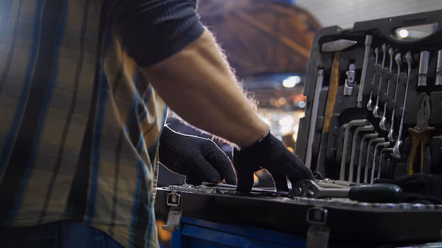 Mechanic adjusting his tools